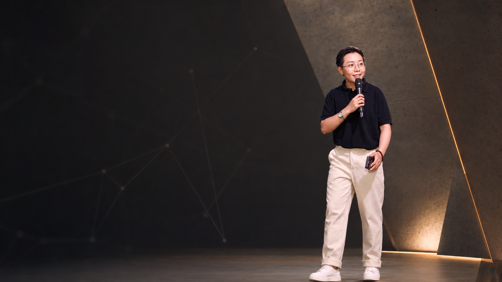 Dennis speaking on stage